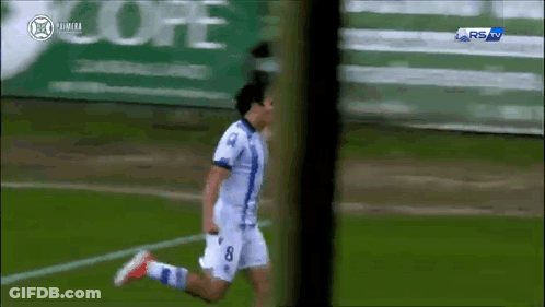 A Soccer Player With The Number 8 On His Jersey Is Running On A Field GIF