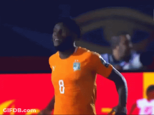 A Soccer Player With The Number 8 On His Jersey Is Running On The Field GIF