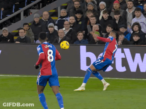 A Soccer Player With The Number 8 On His Jersey Kicks The Ball GIF