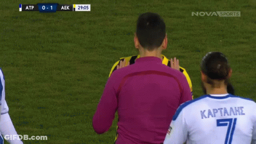 A Soccer Player With The Number 8 On His Jersey Talks To A Referee GIF