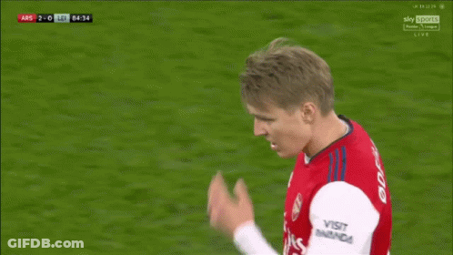 A Soccer Player With The Number 8 On His Shorts Is Bending Over On The Field GIF