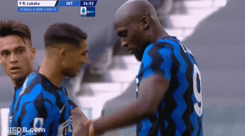 A Soccer Player With The Number 9 On His Back Shakes Hands With Another Player GIF