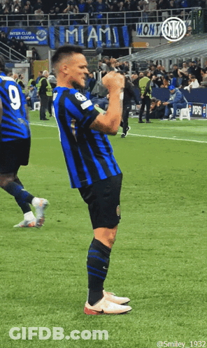A Soccer Player With The Number 9 On His Back Stands On The Field GIF