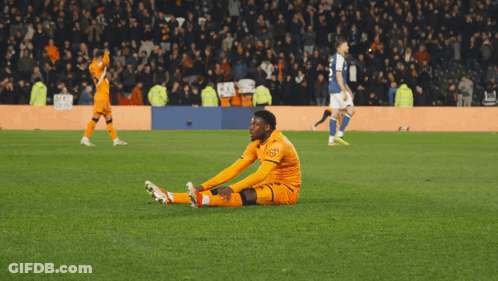 A Soccer Player With The Number 9 On His Jersey Is Being High Fived By Another Player GIF