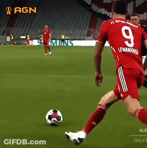 A Soccer Player With The Number 9 On His Jersey Is Kicking The Ball GIF