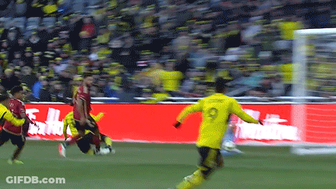 A Soccer Player With The Number 9 On His Jersey Kicks The Ball GIF