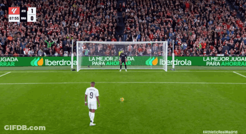 A Soccer Player With The Number 9 On His Jersey Stands In Front Of A Goal GIF