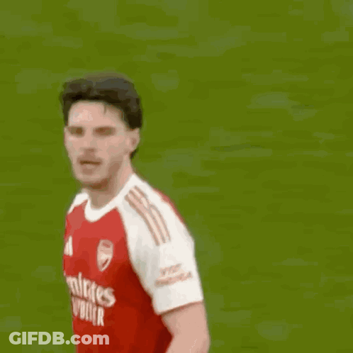 A Soccer Player With The Number 9 On His Shorts Jumps Into The Air GIF