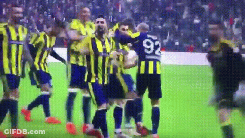 A Soccer Player With The Number 92 On His Jersey Is Surrounded By His Teammates GIF