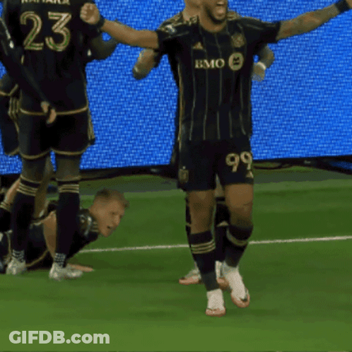 A Soccer Player With The Number 99 On His Shorts Celebrates A Goal GIF