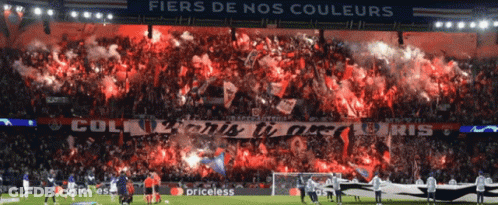 A Soccer Stadium With A Banner That Says Fiers De Nos Couleurs On It GIF