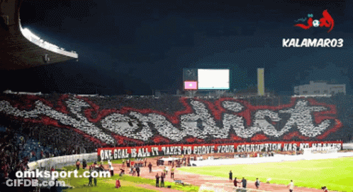 A Soccer Stadium With A Banner That Says " One Goal Is All It Takes To Prove Your Corruption Has No Room " GIF