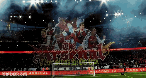 A Soccer Stadium With A Banner That Says The Arsenal GIF
