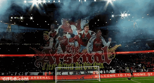 A Soccer Stadium With A Banner That Says The Arsenal GIF