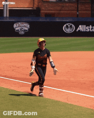 A Softball Player Is Running On The Field In Front Of An Allstate Sign GIF