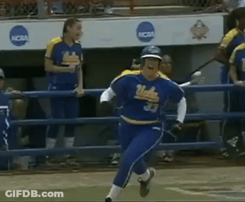 A Softball Player Wearing A Number 33 Jersey Is Running On The Field . GIF