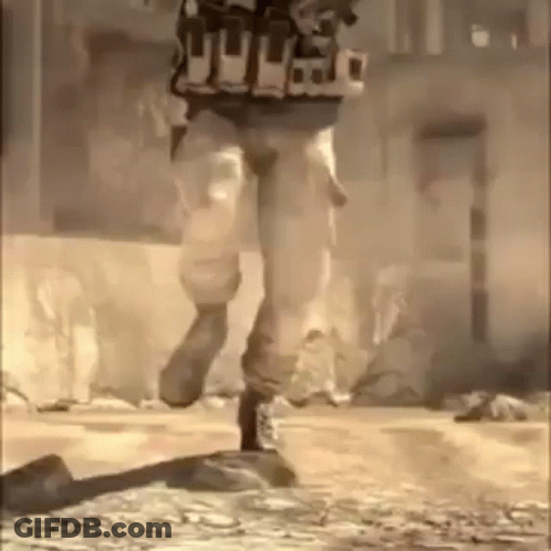 A Soldier Is Running Down A Street In A Video Game While Wearing A Vest . GIF