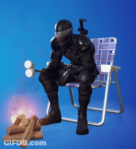 A Soldier Is Sitting In A Chair With A Marshmallow Stick GIF