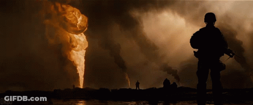 A Soldier Is Standing In Front Of A Large Fire And The Word Orbo Is On The Bottom Right GIF