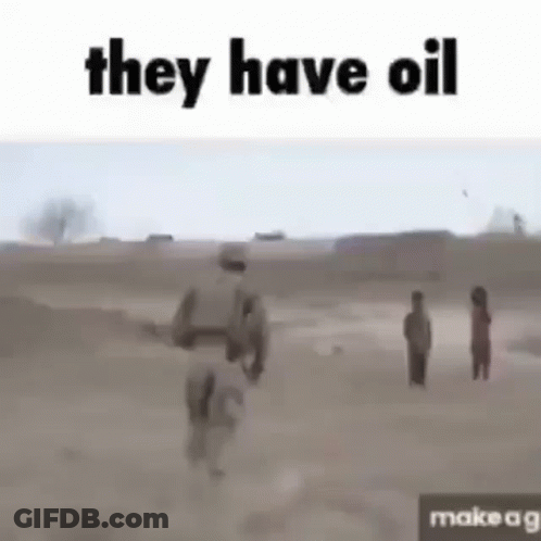 A Soldier Is Walking Through A Dirt Field With A Group Of Children . GIF