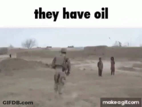 A Soldier Is Walking Through A Dirt Field With Two Children And Says They Have Oil . GIF