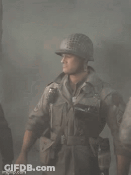 A Soldier Is Wearing A Helmet And Holding A Grenade GIF