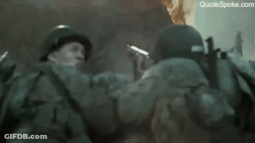 A Soldier Says " Do N't Shoot Let 'Em Burn " In Front Of A Fire GIF