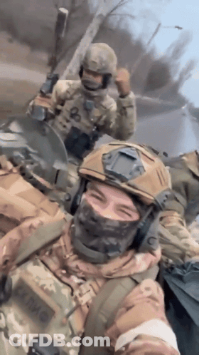 A Soldier Wearing A Helmet And A Mask Has The Letter O On His Chest GIF