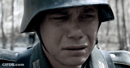 A Soldier Wearing A Helmet Is Crying With Tears Coming Out Of His Eyes GIF