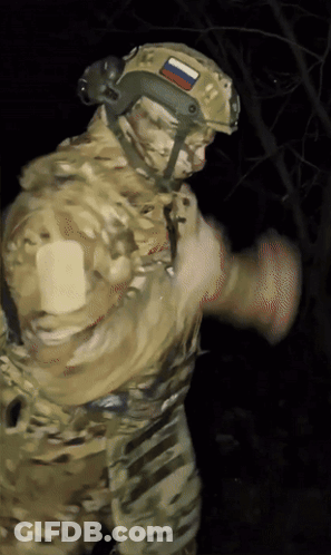A Soldier Wearing A Helmet With A Russian Flag On It GIF