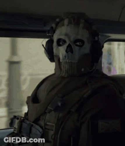 A Soldier Wearing A Skull Mask And Headphones GIF