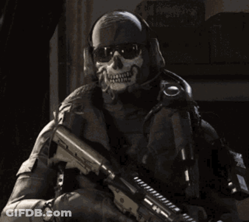 A Soldier Wearing A Skull Mask Holds A Gun GIF
