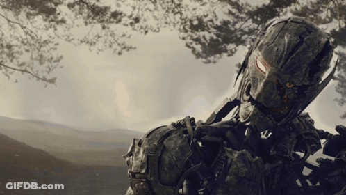 A Soldier With A Helmet That Says ' Us Army ' On It Is Holding A Gun GIF