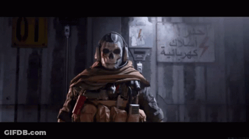 A Soldier With A Skull On His Face Stands In Front Of A Sign That Says 01 GIF