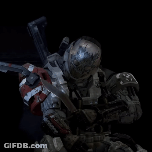 A Soldier With A Skull On His Helmet Is Holding A Gun GIF