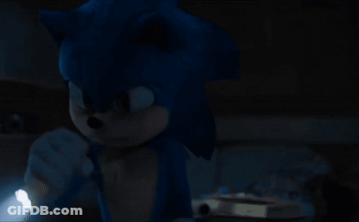 A Sonic The Hedgehog Holding A Flashlight In The Dark GIF