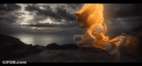 A Sonic The Hedgehog Is Flying Through The Air With A Cloudy Sky In The Background GIF