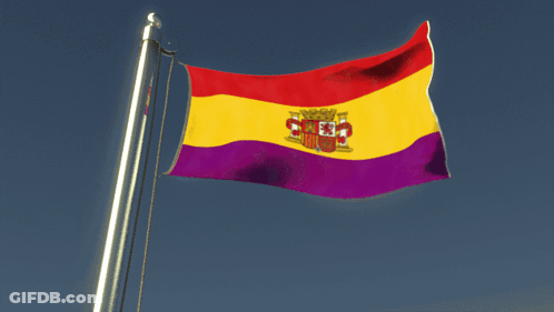 A Spanish Flag Is Waving In The Wind With A Blue Sky In The Background GIF