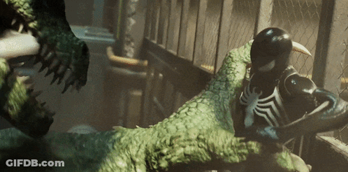A Spider Man Is Fighting A Crocodile In A Dark Room GIF