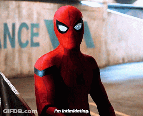 A Spider Man Says I 'M Intimidating In Front Of A Wall With The Word Ance On It GIF