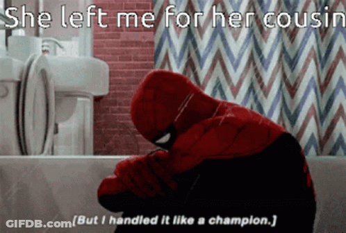 A Spider Man Sitting In A Bathtub With His Head Down GIF