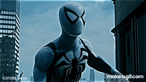 A Spider Man Standing In Front Of A City With Makeagif.com Written On The Bottom Right GIF
