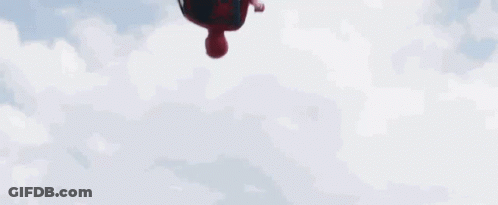 A Spiderman Holding A Captain America Shield In The Air GIF