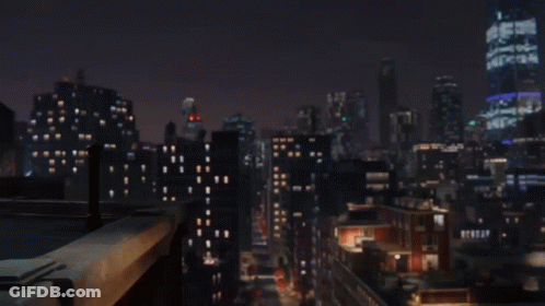 A Spiderman Is Holding A Box Of Pizza In His Hand GIF