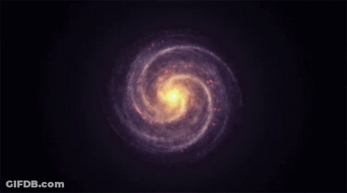 A Spiral Galaxy In The Night Sky With A Yellow Center GIF