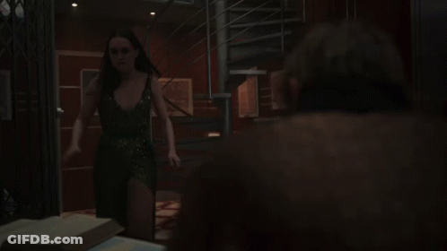 A Spiral Staircase In A Dark Room With A Compass In The Middle GIF