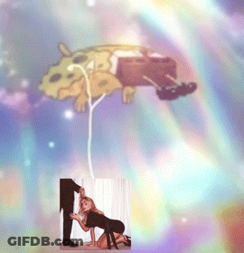 A Spongebob Balloon Is Being Held By A Man And A Woman GIF