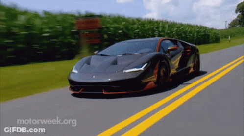 A Sports Car Is Driving Down A Road With Motorweek.org Written On The Bottom GIF