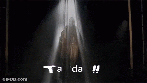 A Spotlight Shines On The Word Tanda Which Is On A Black Background GIF