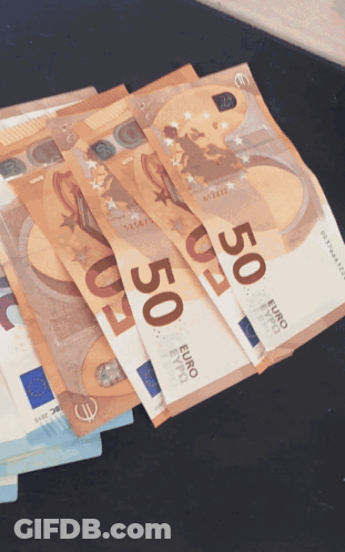 A Stack Of 50 Euro Bills On A Black Surface GIF